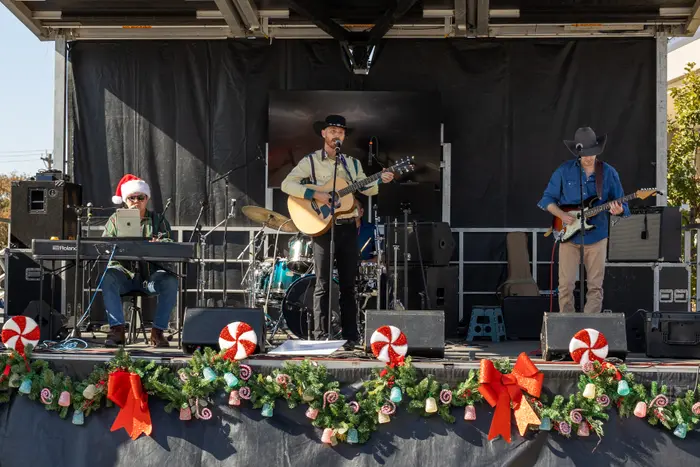 Retro Gringos on stage at a holiday festival